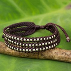 Silver beads of Karen hill tribe origin shine brightly among the dark maroon braids that shape this trendy wristband. Napapat crafts the bracelet by hand featuring a sliding knot that allows it to be adjusted to the desired length. Maroon Braids, Bali Jewelry, Dark Maroon, Silver Choker Necklace, Wristband Bracelet, Silver Choker, Sliding Knot, Micro Macrame, Mens Accessories Fashion