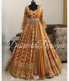 Made to Order/Measurement/Custom Order Lehenga - Color : orange brown - Fabric : Pure Silk - Fully flared paneled lehenga -   Pure Banarasi  Silk -   Attached  Dupatta with Blouse - Drawstring closure with Tassels - - It can be customize in any design or size  PLEASE NOTE: BUYERS ARE RESPONSIBLE FOR ANY CUSTOMS AND IMPORT TAXES THAT MAY APPLY. This is a made to order product. If you opt for 'Made To Measurement Option', we will provide a measurement template and you can share the measurements li Designer Orange Sharara With Zari Work, Designer Orange Sharara With Traditional Drape, Unstitched Orange Anarkali Set With Gota Work, Orange Salwar Kameez With Cutdana For Navratri, Designer Orange Sharara For Navratri, Orange Semi-stitched Salwar Kameez With Cutdana, Semi-stitched Orange Cutdana Anarkali Set, Designer Orange Cutdana Dupatta, Orange Cutdana Dupatta For Designer Wear