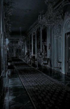 an old black and white photo of a long hallway with chandeliers on either side