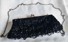 Vintage black beaded Bijoux Terner evening bag with strap. This bag is in really nice condition I don't see much wrong with it but with any vintage item there may be imperfections. There is a double row of beads under the clutch for a finished look. The strap is 46".  This item will be sent tracked package within Canada. Outside Canada this item will be sent International air mail no tracking. If you prefer tracking please purchase at checkout. Handmade Black Clutch Evening Bag, Elegant Handmade Black Clutch, Elegant Black Handmade Clutch, Handmade Black Evening Bag For Events, Black Beaded Evening Bag As Gift, Black Beaded Evening Bag For Gift, Black Beaded Rectangular Clutch, Elegant Black Beaded Rectangular Evening Bag, Elegant Rectangular Black Beaded Evening Bag