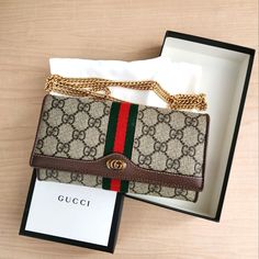 (New With Original Tags!) Gucci Gg Supreme Monogram Web Ophidia Wallet With Chain And Built-In Mirror Can Be Used As A Wallet Or A Chain Bag. Brand New And Never Used, No Signs Of Wear. Flawless Condition And Comes With The Original Tags, Original Dust Bag, And Original Box. Have An Authentication Certificate As Well For Proof Of Authenticity. Smoke Free Household. Gucci Gold Wallet On Chain With Chain Strap, Chic Gucci Gold Wallet On Chain, Gucci Gold Wallet On Chain For Everyday Use, Gucci Gold Wallet On Chain With Gold-tone Hardware, Gucci Gold Rectangular Wallet On Chain, Chic Gold Gucci Wallet On Chain, Designer Brown Wallet On Chain With Chain Strap, Elegant Gucci Wallet On Chain As Gift, Classic Gucci Wallet On Chain In Rectangular Shape