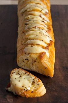 a long piece of bread with cheese on it