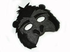 a black and grey mask on a white background