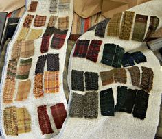 several pieces of cloth laid out on top of each other in different colors and patterns