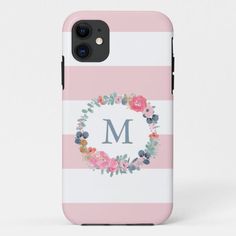 a pink and white striped phone case with floral wreath on the front, monogrammed