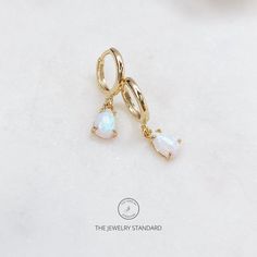 Delicate Gold opal drop hoop earrings DETAILS: *12mm Small hoops- Gold plated over sterling silver *4x6 lab opal charms Gold plated over sterling silver *One touch Hinge closure  SHIPPING: *Free domestic shipping on all orders PACKAGING: *All pieces come beautifully packaged, perfect for gift giving. Find more to ❤️ here: http://etsy.com/shop/thejewelrystandard opal earrings, hoop earrings, Small earrings, dainty earrings, Gold opal hoop earrings, opal earrings, Smalls, earrings, birthday gifts Earrings Opal, Dainty White Huggie Dangle Earrings, Dainty White Dangle Huggie Earrings, Earrings Hoops, Gold And Opal Earrings, Cute Opal Earrings, Opal Hoop Earrings As A Gift, Small Gold Hoop Earrings With Opal, Opal Huggie Hoop Earrings As A Gift