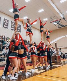 the cheerleaders are doing tricks on the court