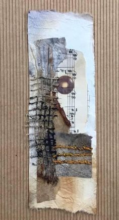 altered collage with music notes on cardboard