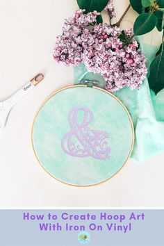 the monogrammed embroidery kit is next to flowers and scissors