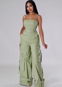 The Jocelyn Jumpsuit screams style. This on-trend wide leg cut cargo jumpsuit features adjustable spaghetti straps, belt loops, side pockets and the perfect amount of stretch. Style it with a bodysuit/cropped jacket for more coverage/a different vibe. Inseam: 34 inches Color: Light Olive Model is 5 ft 8 in tall and wearing heels If you are top heavy and in between sizes, go up a size. Sizes: L fits sizes 10/12 - as shown on our owner, Tamika (size 10/12) Beige Jumpsuit, Cargo Jumpsuit, 2piece Outfits, Chic Dress Classy, Tank Jumpsuit, Kids Dress Wear, Cargo Pants Outfit, Fashion Top Outfits