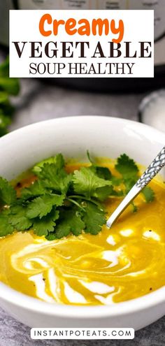 a white bowl filled with soup and garnished with cilantro