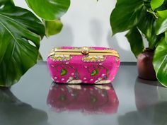 Feel special with this beautiful, embroidered clutch. Attractive & affordable fashion accessory designed using rich fabric and intricate work. Perfect for gifting on occasions like baby shower, housewarming, wedding, sangeet, return gift, griha pravesh pooja, Diwali, Holi, Ganpati, Dussehra, Durga pooja, Laxmi Pooja, Eid, Ramadan, Gudi Padwa, Onam, Pongal, Ugadi, Navratri etc. The Pichwai designs are one of the most ancient forms of paintings with origin from Rajasthan. This design usually depic Dori Work Potli Clutch Bag As Gift, Dori Work Clutch Potli Bag As Gift, Clutch Potli Bag With Dori Work For Gift, Festive Gift Potli Bag, Rectangular Embroidered Clutch For Celebration, Festive Multicolor Clutch, Festive Multicolor Rectangular Clutch, Multicolor Handwork Clutch For Celebration, Multicolor Clutch With Zari Work For Party