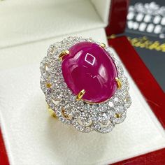 What you see in the pictures, is what you will get! No duplicates or twins! One of a kind EXTREMELY GORGEOUS AND RARE CERTIFIED NO-GLASS-FILLING, GENTLE HEAT ONLY, VIVID RED, BURMESE RUBY RING. This ruby is so rare! At 18.46 carats! Extremely huge! With stunning vivid red color and excellent depth and translucent quality, VS clarity. Rare BURMESE, signature RED Color, EXTREMELY BEAUTIFUL! With SUBSTANTIAL halo of brilliant round, F/VS diamonds. Set in a LUXURIOUS DESIGNED, 18K solid yellow gold Luxury Ruby And Diamond Oval Cabochon Ring, Luxury Ruby Ring With Oval Cabochon Diamond, Luxury Ruby Cabochon Diamond Ring, Luxury Cabochon Ruby Ring For Anniversary, Formal Ruby Ring With Diamond And Oval Cabochon Shape, Formal Cabochon Ruby Ring, Formal Oval Cabochon Ruby Ring With Diamond, Formal Round Cabochon Diamond Ring, Formal Cabochon Diamond Ring