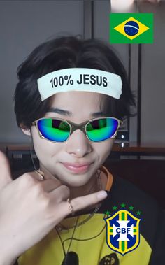 a woman wearing sunglasses and a headband with the word jesus on it