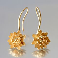 Gold Earrings - Small 18kt waterlilies are fixed on a gracefully-curved gold wire that forms into a gold ear wire.  Originally crafted from sterling silver sheet, they have been cast in gold and finished with a satin texture.  Liquid dip is recommended to maintain the bright luster. Delicate Sterling Silver Yellow Gold Earrings, Gold Flower Earrings With Ear Wire For Formal Occasions, Delicate Handmade Yellow Gold Earrings, Delicate Gold Jewelry With French Hook, Formal Gold Flower Earrings With Ear Wire, Yellow Gold Drop Earrings With Flower Design, Dainty Yellow Gold Earrings With French Hook, Elegant Floral Earrings With French Hook, Elegant Flower Shaped Earrings With French Hook