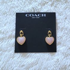 Brand New On Product Card Coach Carved Rosequartz Heart Drop Earrings Excellent Condition With No Flaws Drop Approx 7/8" Raised, Heart Shaped Rose Quartz With Signature Gold "C" Hardware Link Post Back Closure Please No Trades Or Lowballs! *Ask Any Questions You May Have Prior To Making An Offer Or Purchase Please* Coach Heart Charm Heart Jewelry, Coach Heart Charm Jewelry, Coach Elegant Heart-shaped Jewelry, Elegant Coach Heart-shaped Jewelry, Coach Elegant Heart Jewelry, Elegant Coach Heart Shaped Jewelry, Coach Gold Heart-shaped Jewelry, Coach Heart-shaped Gold Jewelry, Coach Heart-shaped Jewelry For Gift