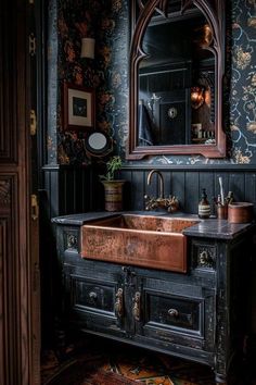 an old fashioned sink in the corner of a room with black walls and floral wallpaper