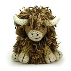 a brown and white stuffed animal with horns