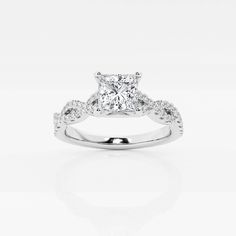 an engagement ring with a princess cut diamond in the center and pave set shoulders