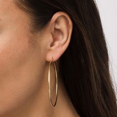 Achieve an effortless yet chic look with these classic 14K gold hoop earrings - a must-have fashion staple for your growing jewelry collection. Created in 14K gold Each earring showcases a simple yet bold 60.0mm-wide tubular hoop. These earrings secure with latch backs. Classic 14k Gold Filled Hoop Earrings For Everyday Luxury, Minimalist 14k Gold Filled Hoop Earrings For Formal Occasions, Minimalist 14k Gold Hoop Earrings For Formal Occasions, Minimalist 14k Gold Hoop Earrings For Formal Events, Formal Minimalist 14k Gold Hoop Earrings, Modern 14k Gold Hoop Earrings, Minimalist Hoop Earrings For Everyday Elegance, Formal 14k Gold Filled Hoop Earrings, Classic Yellow Gold Hoop Earrings For Everyday Elegance