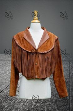 Our Women Tan Brown Native Indian Southwestern American Fringe Beaded Suede Leather Trench Jacket is a striking and culturally significant fashion piece that pays you the rich heritage of Native American tribes in the Southwestern United States. This exquisite Jacket/Coat/Pants is a beautiful fusion of style and tradition, showcasing the craftsmanship and artistry of indigenous peoples. This exquisite Women's Vintage Fringe Leather Jacket, a true embodiment of retro chic. Crafted with buttery so Bohemian Long Sleeve Outerwear For Rodeo, Bohemian Winter Leather Jacket With Fringe, Bohemian Long Sleeve Leather Jacket With Fringe, Bohemian Fringe Outerwear For Rodeo, Bohemian Brown Outerwear For Rodeo, Brown Bohemian Leather Jacket For Fall, Bohemian Brown Leather Jacket For Fall, Bohemian Brown Leather Jacket For Winter, Bohemian Fitted Leather Jacket For Winter