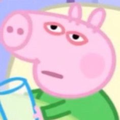 peppa the pig is holding a glass in his hand