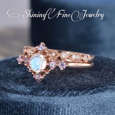 Alexandrite And Moonstone Engagement Ring Set Rose Gold Moonstone Bridal Set Antique Unique Art Deco Ring Anniversary Gift Milgrain Curved Link to main ring: https://www.etsy.com/listing/779949818 Link to wedding band: https://www.etsy.com/listing/789514199 Product Details Engagement Ring: -Center Stone: Natural Moonstone, 5mm, Round Cut -Side Stone: Lab Alexandrite, 2.1mm, Round Cut -Ring Band: 1.5mm Wedding Band: -Stone: Genuine Diamonds, G Color, VS clarity -Weight: 0.13CT Total -Ring Band: 2 Round Moonstone Jewelry With Gemstone Accents, Luxury Antique Moonstone Wedding Ring, Moonstone Ring With Gemstone Accents, Moonstone Ring With Gemstone Accents As Gift, Anniversary Moonstone Jewelry With Gemstone Accents, Rose Gold Moonstone Jewelry With Birthstone, Rose Gold Moonstone Jewelry With Gemstone, Wedding Jewelry With Moon Shaped Gemstone, Luxury Victorian Moonstone Wedding Ring