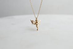 "The Baby Angels - Praying for Peace and Cloaked, the details are unreal! Detailed features all around, super dainty and precious Add a touch of minimalist elegance to your jewelry collection with our 18K Gold Dipped Prayer Baby Angel Necklace. The pendant features detailed texture The 18K gold plating adds a luxurious touch, while the adjustable chain ensures a perfect fit for any neckline. This versatile necklace is perfect for everyday wear or special occasions, and it also makes a thoughtful gift for someone special. Embrace the simplicity and timeless charm of this piece pendant necklace and elevate your style to new heights. -Gold Color 18K Gold Dip * Brass Casting * Lead & Nickel Free MEASURES * Necklace Length: 16\" with a 2-inch extender chain * Pendant Width: 0.45\" * Pendant Hei Baby Angel Necklace, Angels Praying, Y2k Jewelry, Angel Necklace, Baby Angel, Gold Dipped, Best Friend Gift, Chain Pendant, Gold Plated Silver