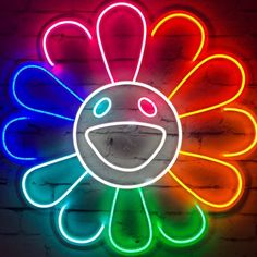 a neon sign with a smiley face on it