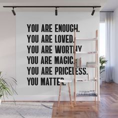 a black and white wall mural with the words you are enough, you are loved, you are worthy, you are magic, you are priceless, you matter