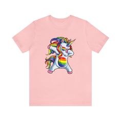 Unicorn Pride Tee Celebrate unicorn-style with this fashionable tee. Whether you're a friend of the mythical equines or just appreciate a trendsetter look, you'll be ready to show off your pride! (Cue the rainbows and the sparkles!) 100% Airlume combed & ringspun cotton (varies by color) Light fabric (4.2 oz/yd² (142 g/m²)) Unisex Retail fit Ribbed knit collar for better fit, reinforced shoulders for shape retention Tear away label Double-stitched seams for strength True to size This product is Fun Unicorn Print T-shirt For Summer, Trendy Multicolor Pride T-shirt, Trendy Rainbow Pride T-shirt, Trendy Rainbow T-shirt For Pride, Playful Rainbow Graphic Print T-shirt, Playful Multicolor Rainbow Print T-shirt, Playful Cotton T-shirt With Unicorn Print, Trendy Rainbow Top For Pride, Trendy Rainbow Short Sleeve T-shirt