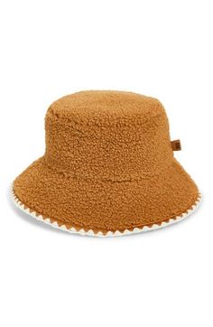 Top off your cold-weather looks with the signature UGG coziness of this fluffy faux-fur bucket hat finished with scalloped stitching. Lined 100% polyester Hand wash, dry flat Imported Fur Bucket, Faux Fur Bucket Hat, Fur Bucket Hat, Pink Uggs, Fleece Hats, Pink Accessories, Scallop Trim, Women's Headwear, Leather Label