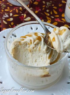 a spoon in a bowl filled with ice cream