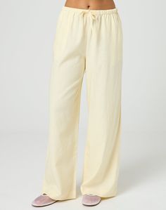 These tie waist pants feature a relaxed leg style and a mid rise fit. Chic Drawstring Bottoms For Spring, Chic Spring Bottoms With Drawstring, Chic Cotton Bottoms With Drawstring, Chic Linen Drawstring Bottoms, Chic Linen Wide Leg Pants With Drawstring, Chic Wide Leg Pants With Drawstring In Relaxed Fit, Chic Wide Leg Pants With Drawstring And Relaxed Fit, Wide Leg Drawstring Pants For Day Out, Chic Spring Pants With Drawstring