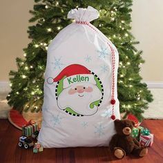 a christmas sack sitting next to a tree