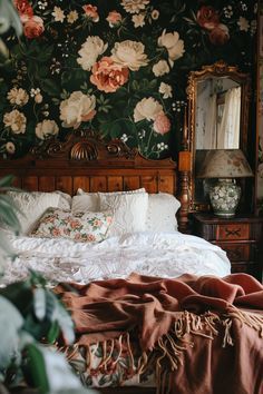 a bedroom with floral wallpaper and a bed in the middle, surrounded by greenery