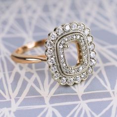 a diamond ring sitting on top of a table