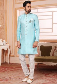 Art Silk Jacquard Asymmetric Sherwani in Sky Blue This Readymade attire with Satin Lining is Enhanced with Buttons, Brooch, Pocket and Resham Work. Crafted in Chinese Collar Neck and Full Sleeve Available with an Art Dupion Silk Pant in Off White Do note: Footwear shown in the image is for presentation purposes only. Brooch Design and Half to one inch in measurement may vary. (Slight variation in actual color vs. image is possible) Blue Straight Kurta Set For Reception, Blue Chikankari Embroidered Nehru Jacket For Reception, Blue Chikankari Embroidery Kurta For Reception, Blue Kurta With Chikankari Embroidery For Reception, Blue Chikankari Embroidered Kurta For Reception, Blue Straight Kurta For Reception, Blue Traditional Wear With Dabka In Art Silk, Blue Art Silk Traditional Wear With Dabka, Elegant Blue Art Silk Kurta