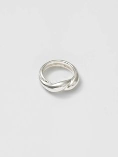 Beyond basic. • 925 Sterling silver twist ring • Band measures 7mm at widest point • Made with recycled metals • Available in size 5-9 Sterling Silver Twisted Rings With Modern Style, Modern Twisted Sterling Silver Rings, Modern Twist Sterling Silver Twisted Ring, Minimalist Silver Twisted Ring, Minimalist Twisted Silver Ring, Twisted Sterling Silver Rings, Twist Ring Band, Twisted Band Ring, Twist Ring