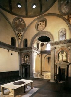 the interior of an old church with stained glass windows