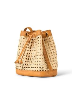 Bembien's Benna bag will be your new go-to this season. The mini bucket silhouette is handcrafted from woven rattan and finished with leather for a polished look that's perfect for breezy days. Complement the cutouts by pairing it with easygoing summer styles. Mini Bucket, Woven Rattan, Fire Heart, Leather Bucket Bag, Leather Bucket, Handbag Accessories, Crossbody Shoulder Bag, Leather Trims, Style Guides