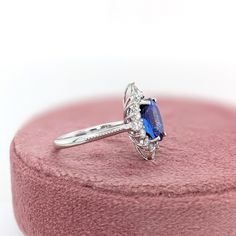 This beautiful ring features a 3.16 carat oval Tanzanite gemstone with a halo of natural earth mined diamonds set in solid 14K gold. This Tanzanite ring makes a lovely December birthstone gift for your loved ones! This ring is made with solid 14K Gold and natural Earth mined SI / G-H diamonds. As listed, this ring is ready to ship. If you're interested in purchasing this setting with a different center stone please message us! Designer Silver Jewellery, Jewelry Showcases, Tanzanite Ring, Tanzanite Gemstone, Birthstone Gifts, December Birthstone, Natural Earth, Beautiful Ring, Earring Findings