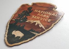 the national park service sign is hanging on the wall