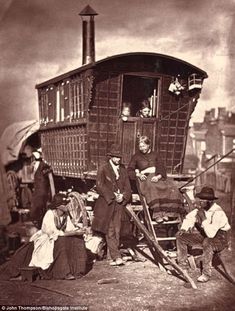 an old black and white photo of people near a train