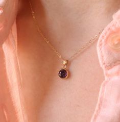 Indulge in timeless elegance with our 14K Gold Amethyst Necklace. This exquisite piece showcases a stunning amethyst gemstone, known for its rich purple hues and captivating brilliance. Crafted from high-quality 14K gold, the necklace features a delicate chain, perfectly complementing the vibrant amethyst pendant. The amethyst gemstone is believed to possess healing properties and symbolize inner strength and balance. Wear this necklace as a personal talisman or gift it to a loved one to convey Elegant Purple Pendant Birthstone Necklace, Dainty Amethyst Jewelry For Formal Occasions, Elegant Gold Amethyst Birthstone Necklace, Elegant Amethyst Round Pendant Jewelry, Amethyst Birthstone Jewelry For Formal Occasions, Classic Amethyst Birthstone Jewelry, Classic Amethyst Necklace For Gift, Formal Amethyst Birthstone Jewelry, Formal Amethyst Birthstone Necklace