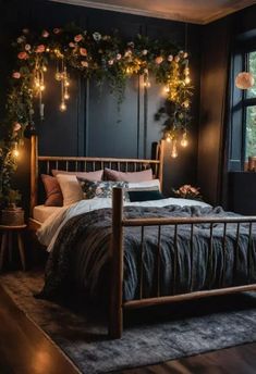 a bedroom with dark walls and flowers on the headboard, lights strung up above the bed