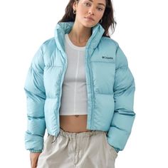 New Columbia Light Blue Cropped Puffect Puffer Jacket Size Xxl Cropped Mock Neck Long Sleeves Zip-Through Fastening Side Pockets Cropped Hem Extreme Comfy Padding Quilted Outer Shell Logo Badge Printed To Chest Has Some Marks And Three Small Holes Where Security Tags Were Approx. Measurements Pit To Pit: 25.5” Length: 27” Waist: 25.5” Sleeve Length: 26” Shoulders: 18.5” Condition: Nwt Spring Outdoor Down Outerwear, Spring Puffer Jacket For Outdoor Activities, Casual Spring Puffer Jacket For Outdoor Activities, Trendy Down Outerwear For Spring, Spring Down Outerwear With Pockets, Trendy Blue Puffer Jacket For Streetwear, Spring Down Puffer Jacket, Blue Down Puffer Jacket With Pockets, Blue Down Puffer Jacket For Streetwear