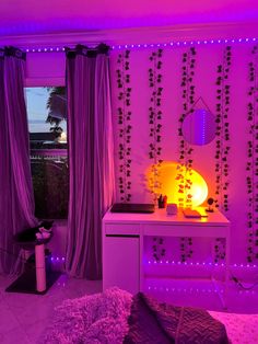 a bedroom with purple lights and curtains