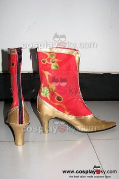 a pair of red and gold boots sitting on top of a white tile floor next to a wall