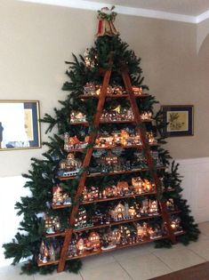 a christmas tree made out of wooden shelves